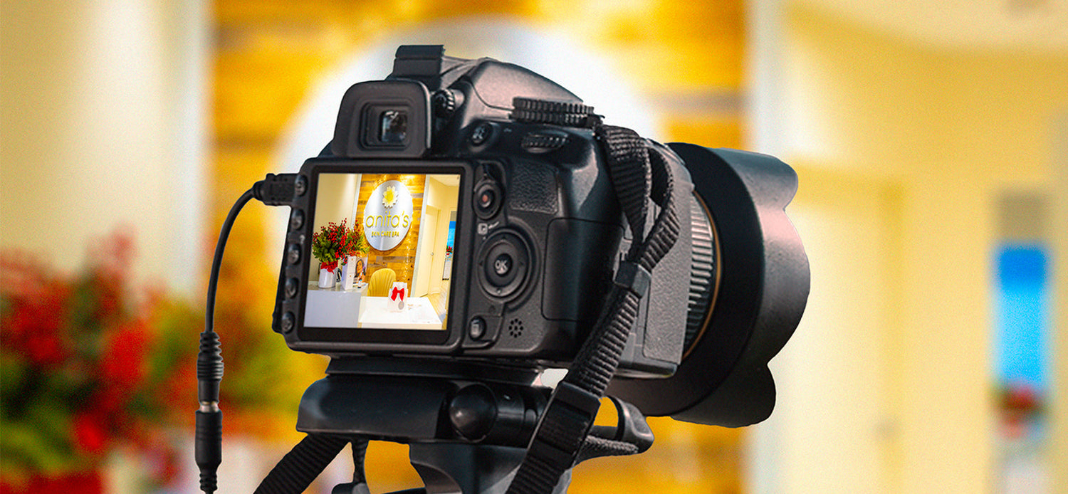 Camera on a tripod with a blurred indoor background